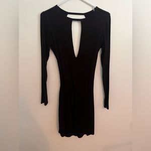 Like new black long sleeved body con with key hole front opening and open back